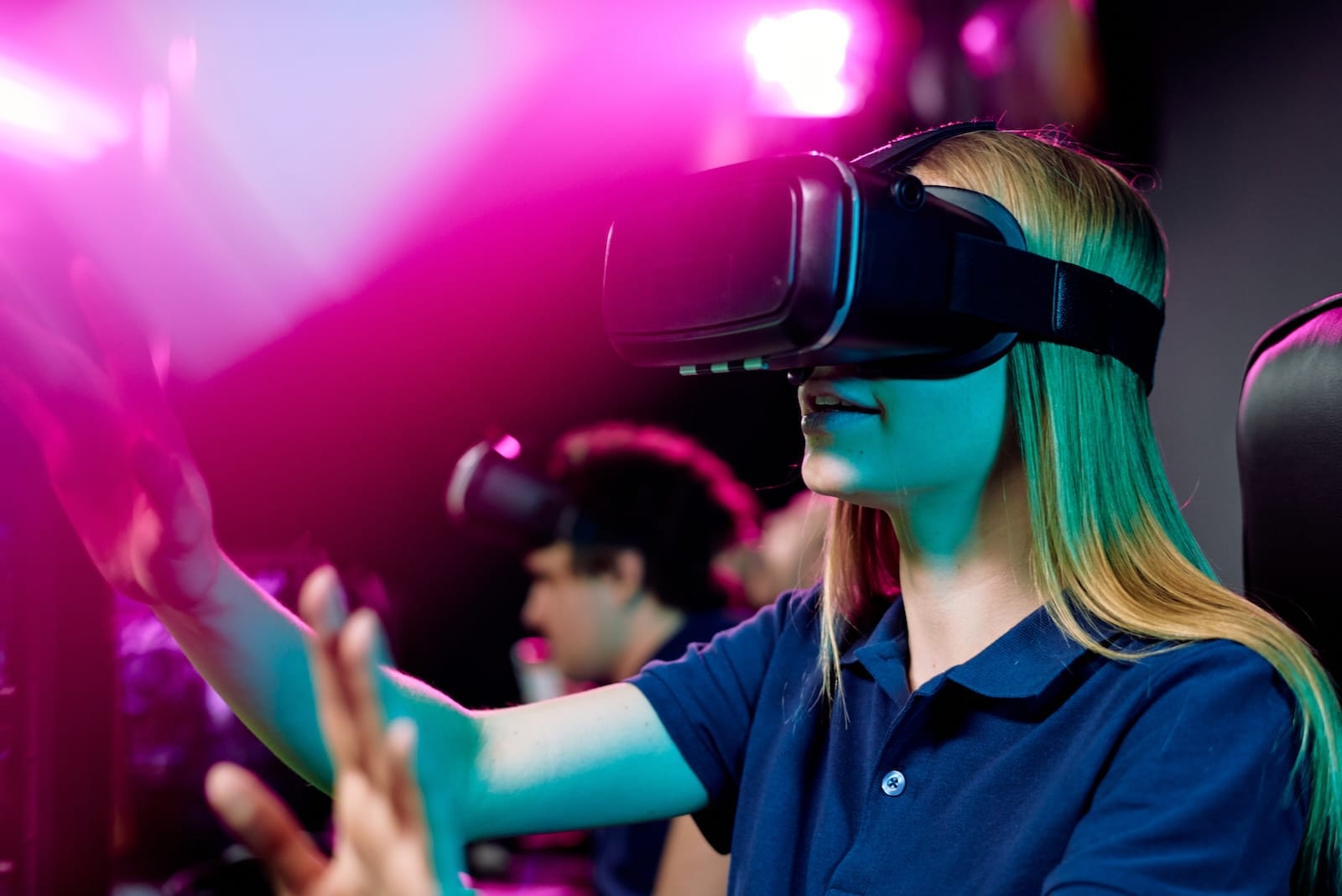 blond-girl-in-vr-goggle-touching-virtual-display-d-2023-11-27-05-25-15-utc blond-girl-in-vr-goggle-touching-virtual-display-d-2023-11-27-05-25-15-utc